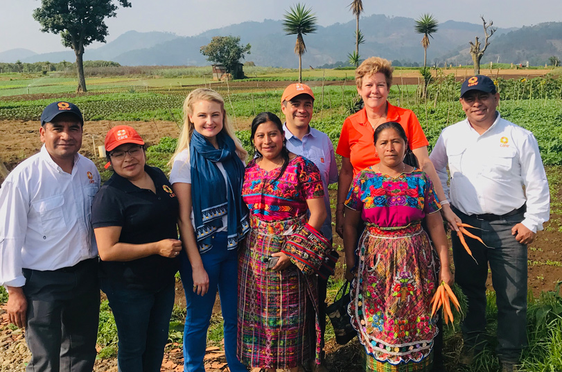Group of farmers standing in a field in Guatemala