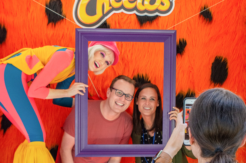 Photo of people in a Cheetos photo booth