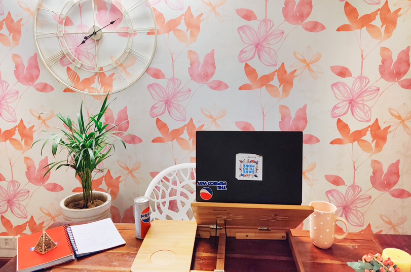 Home office setup with colorful wallpaper